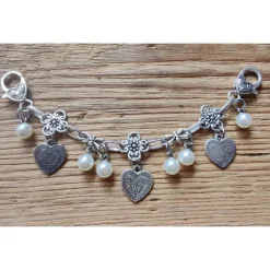 1 Damen - Charivari, 9 Anhänger, antik-silberfarben, ca. 16 cm