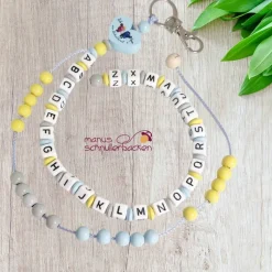 ABC-Rechenkette mit Motivherz "Ich bin ein Schulkind" in Hellblau, Pastellgelb, Hellgrau