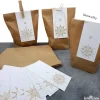 Adventskalender selber befüllen: 24 weiße Kraftpapiertüten & Mandala-Stern Zahlenanhänger