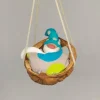 Baumschmuck Walnussschale Schaukelbettchen mit kleinem schlafend Wichtel mit nachtleuchtender Zipfelmütze