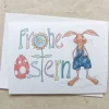 bunte Karte, FROHE OSTERN und Hase in Latzhose, Klappkarte DinA 6, mit Umschlag.