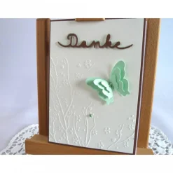 Dankekarte mit Hintergrundprägung und Schmetterling