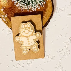 Deko-Figur Lebkuchenfrau, Holz auf Kraftpapier