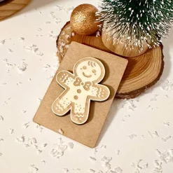 Deko-Figur Lebkuchenmann, Holz auf Kraftpapier