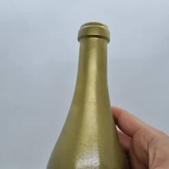 Dekorative Flasche in Kupfer mit Glitzereffekt. Perfekte Tischdekoration für die nächste Feier.