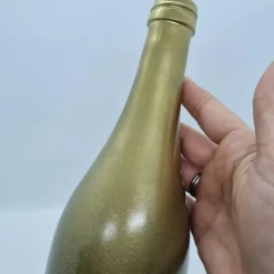 Dekorative Flasche in Kupfer mit Glitzereffekt. Perfekte Tischdekoration für die nächste Feier.