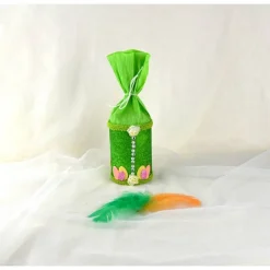 Dekorative Geschenkdosen mit Ostermotiv grün-bunt