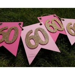 Edle Girlande zum 60. Geburtstag in Pink, Rosa und Gold. Trendige Farben mit glitzernden Zahlen. Geburtstagsdeko Partyde