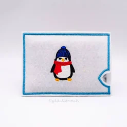 Filzhülle bestickt, weiß für Geschenke mit Pinguin