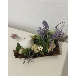 Frühlingsdeko auf Baumrinde Frühlingsgesteck Osterdeko mit einem Vogel