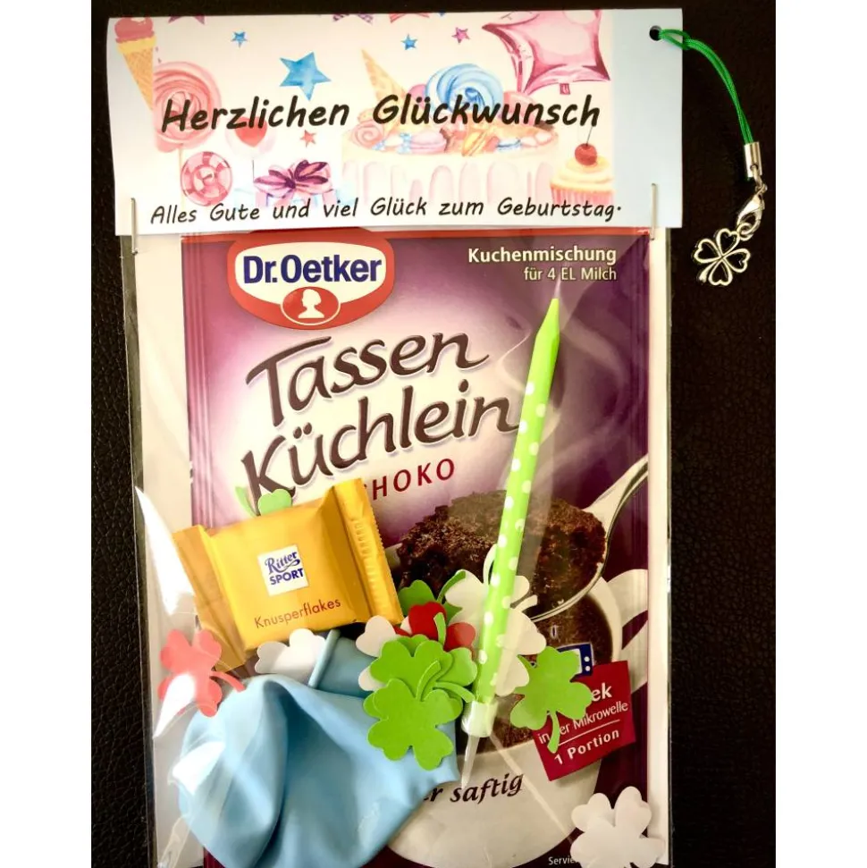Geburtstagsgeschenktüte, Kuchenmischung verpackt mit Kerze, Konfetti und Luftballon, Geburtstagsüberraschung