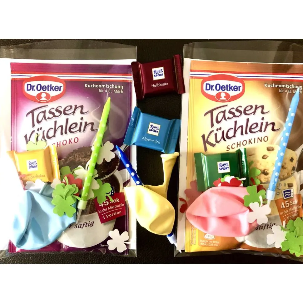 Geburtstagsgeschenktüte, Kuchenmischung verpackt mit Kerze, Konfetti und Luftballon, Geburtstagsüberraschung