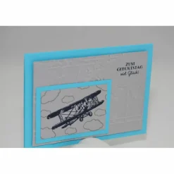 Geburtstagskarte "Flugzeug auf Weltkarte"