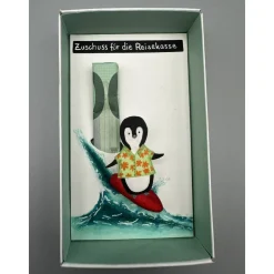 Geschenkbox Reisegeld: Surfender Pinguin als origineller Urlaubszuschuss