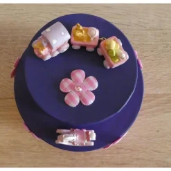 Geschenkverpackung Torte mit Eisenbahn und Schaukelpferd - rosa-lila