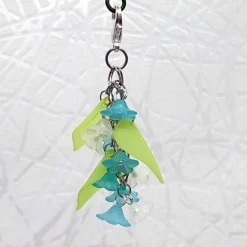 Glücksbringer Taschenbaumler „Zarte Blumen“ türkis – Verspielter Anhänger mit 10 Acrylblüten & Karabiner
