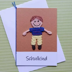 Glückwunschkarte Geldgeschenk Schulanfang mit gehäkeltem Schulkind mit Wunschtext