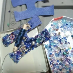 Handbesticktes Unikat-Ornament rot orange – Luxus Perlen-Ei als pompöse Wohndeko & Geschenk