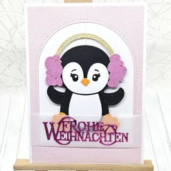 Handgemachte Weihnachtskarte A6 Pinguin rosa Ohrenwärmer | Unikat mit Umschlag & Dekoanhänger