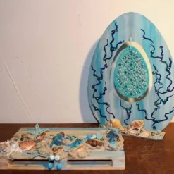 Osterdeko MEERJUNGFRAU  Collage auf einer kleinen Holzpalette maritime Osterdekoration  Osterei Seestern Muscheln