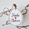 Osterei aus Filz mit zwei Holzperlen - FROHE OSTERN in Schreibschrift - von he-ART by helen hesse