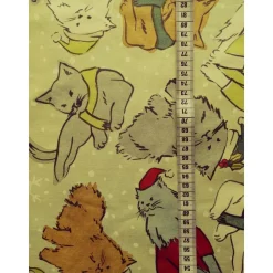 Patchworkstoff Christmas Cats – Zart grüner Baumwollstoff mit Katzen im Schneegestöber