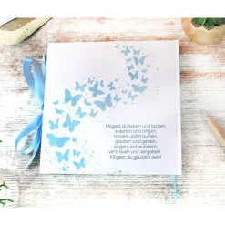 personalisiertes Gästebuch & Album zur Taufe mit Herz aus Schmetterlingen in Hellblau blanko o. mit Fragebogen