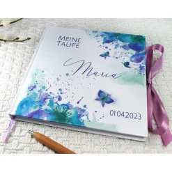 personalisiertes Gästebuch & Album zur Taufe mit Schmetterling & Blume in Türkis / Lila blanko o. mit Fragen