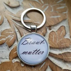 Schlüsselsanhänger Brautmutter schwarz weiß Cabochon silberfarbe Fassung 25mm Gastgeschenk Hochzeit