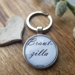 Schlüsselsanhänger Brautzilla Hochzeit schwarz weiß Cabochon silberfarbe Fassung 25mm lustiges Geschenk