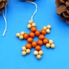 Schneeflocke aus Holzperlen, natur + orange, Design A, Weihnachtsdeko, Advent, Dekoration, Geschenkanhänger, Baumschmuck