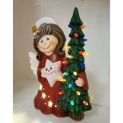 Süsser Engel mit Tanne zum Beleuchten