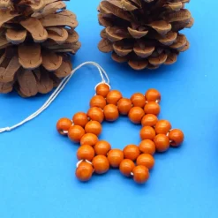 Stern aus Holzperlen, orange, Weihnachtsstern, Advent, Dekoration, Geschenkanhänger, Baumschmuck