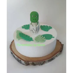Tortendeko Dino aus den Ei  Urzeittier Tortenaufleger Fondantfigur Zuckerfigur