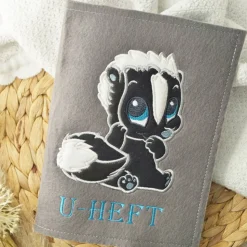 U-Heft-Hülle Stinktier mit praktischen Fächern Filz grau