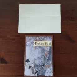 Weihnachtskarte Frohes Fest mit Schneemann und Zweigen