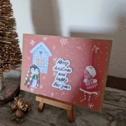 Weihnachtskarte mit Weihnachtsmann - Pinguin - Schneeflocken