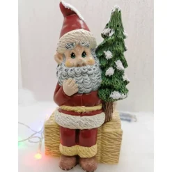 Weihnachtswichtel auf Strohballen