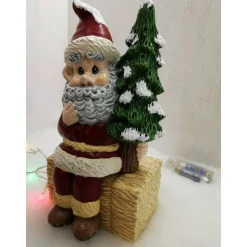 Weihnachtswichtel auf Strohballen