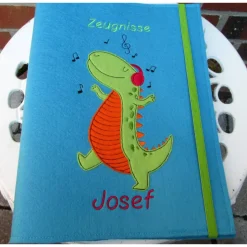 Zeugnissmappe / Zeugnisshülle aus Filz "Dino hört Musik"